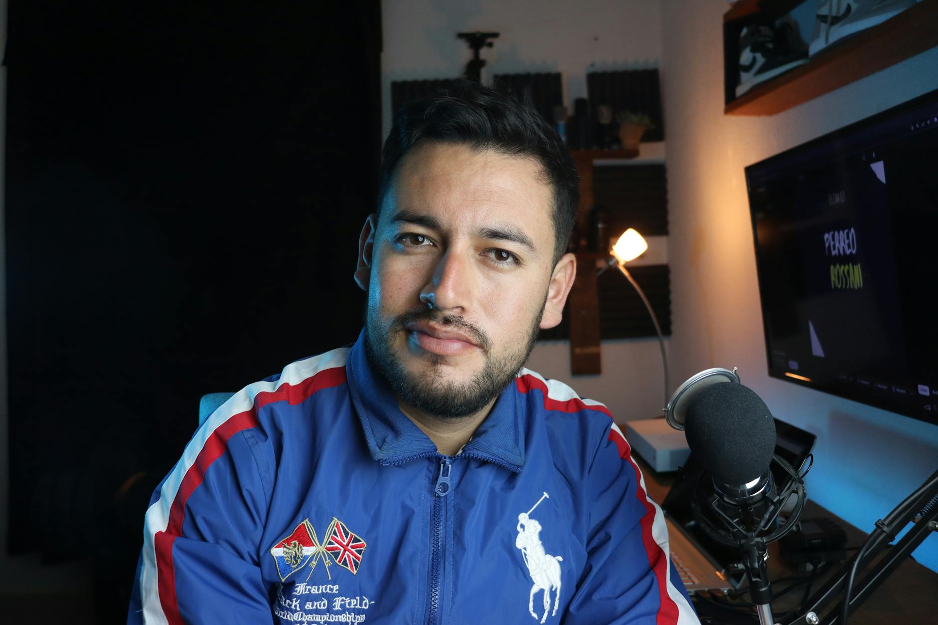 YouTube creator comparing AI video editing tools on a laptop in a home studio setup